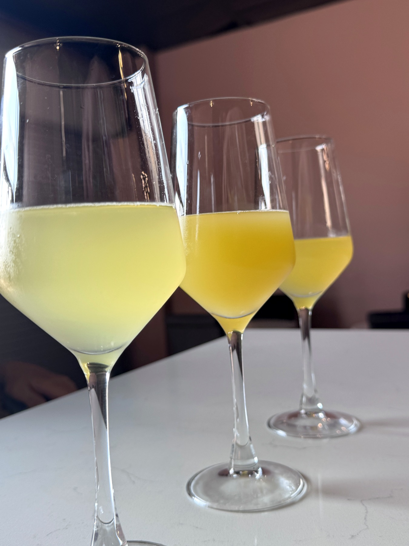 Three colorful frozé drinks
